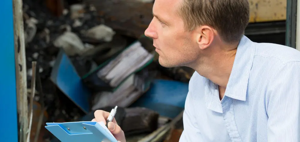 person evaluating damage