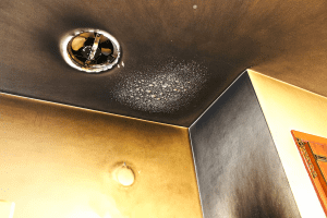 Smoke damage on walls and ceiling.