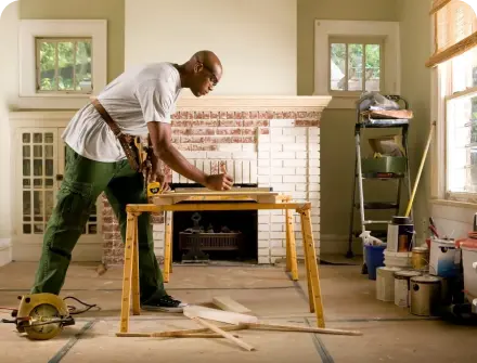 A carpenter in a brightly lit room