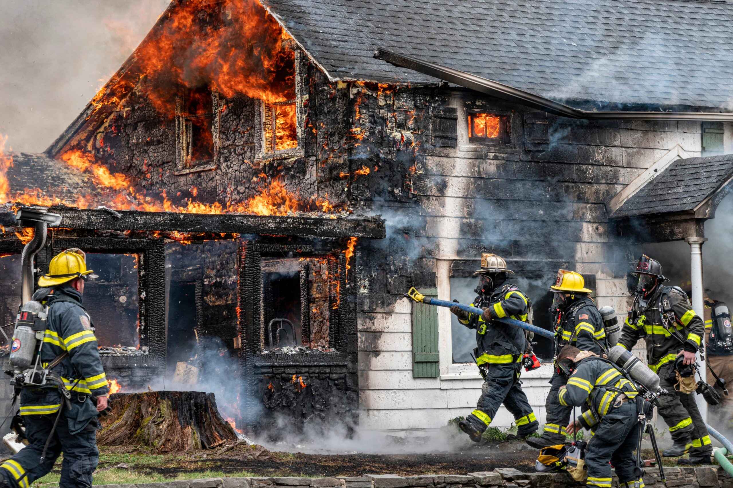 AdobeStock_425341675-1-min-scaled Firefighters putting out house fire